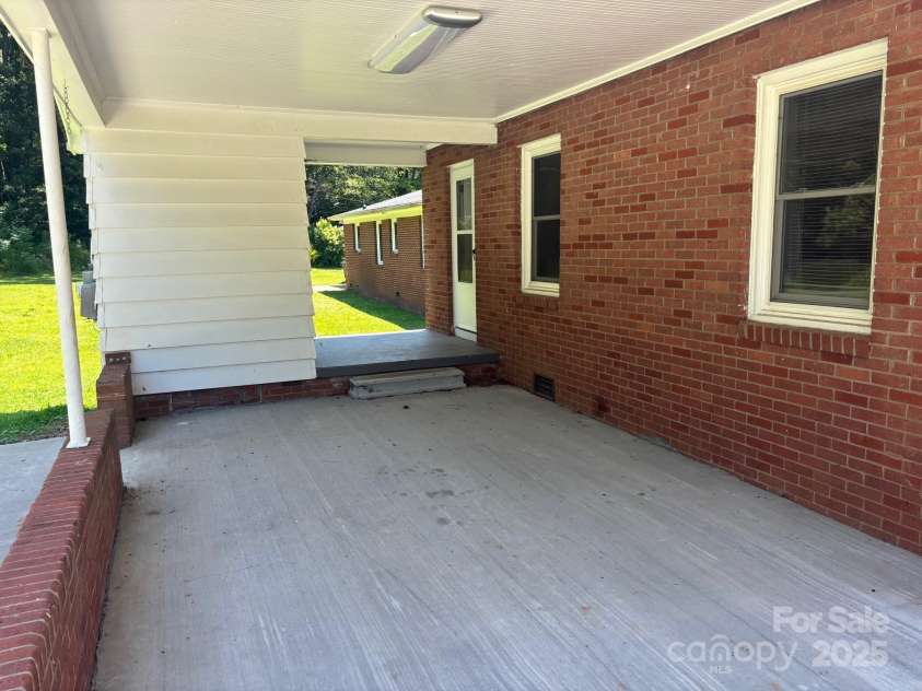 907 McGowan Road, Shelby, NC 28150.  MLS# CAR4251957, YatesRealty ID 20359. Nice 1 car carport with extra parking pad on the side