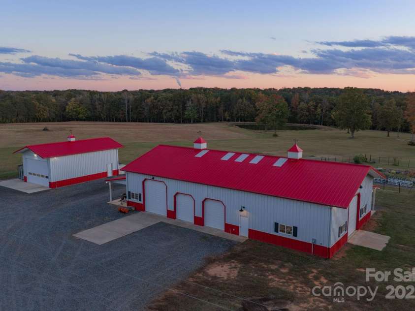 1260 Beaver Island Trail Road, Walnut Cove, NC 27052.  MLS# CAR4325171, YatesRealty ID 2036. Equipment building w/ attached covered porches, built by Morton Buildings, 4 motorized garage doors, and ample space for equipment, storage, or hobby use