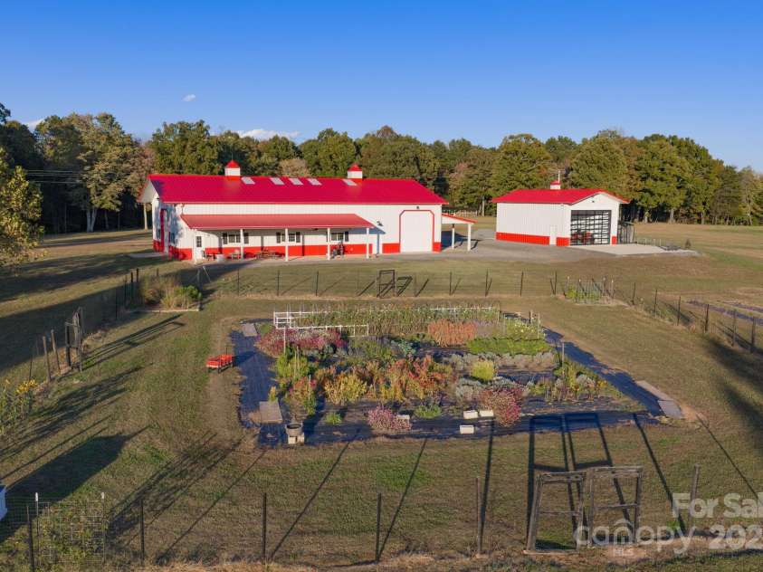 1260 Beaver Island Trail Road, Walnut Cove, NC 27052.  MLS# CAR4325171, YatesRealty ID 2036. Expansive back yard garden w/ fencing