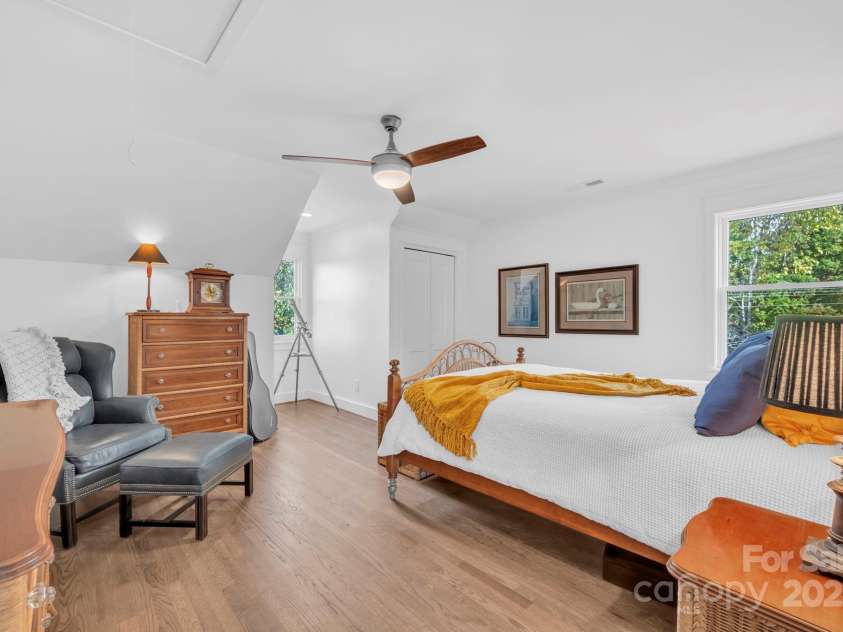 1260 Beaver Island Trail Road, Walnut Cove, NC 27052.  MLS# CAR4325171, YatesRealty ID 2036. Guest bedroom w/ ceiling fan, bi-fold door wall closet, and pull-down attic access (attic not floored)