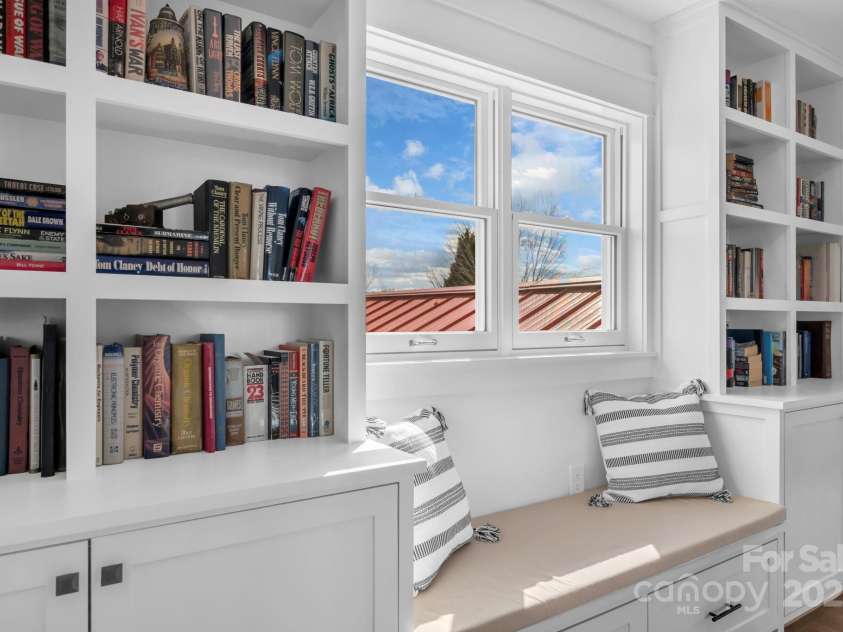 1260 Beaver Island Trail Road, Walnut Cove, NC 27052.  MLS# CAR4325171, YatesRealty ID 2036. Second floor hallway w/ built in bookcases/display shelves w/ cabinet storage and day bench