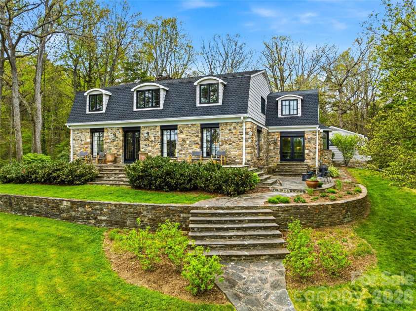 10 Kalimar Heights, Hendersonville, NC 28739.  MLS# CAR4376746, YatesRealty ID 20362. 1912 stone exterior with stone paths and walkways surrounding the property.