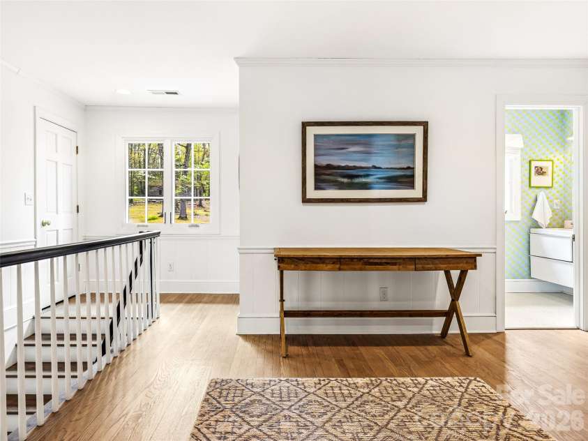 10 Kalimar Heights, Hendersonville, NC 28739.  MLS# CAR4376746, YatesRealty ID 20362. Spacious landing on the second level with access to four bedrooms.  All hardwood flooring is original and refinished. 