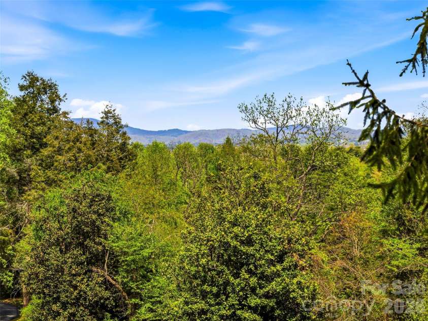 10 Kalimar Heights, Hendersonville, NC 28739.  MLS# CAR4376746, YatesRealty ID 20362. Sweeping front-facing mountain views with eastern exposure, perfectly positioned to capture breathtaking sunrises.