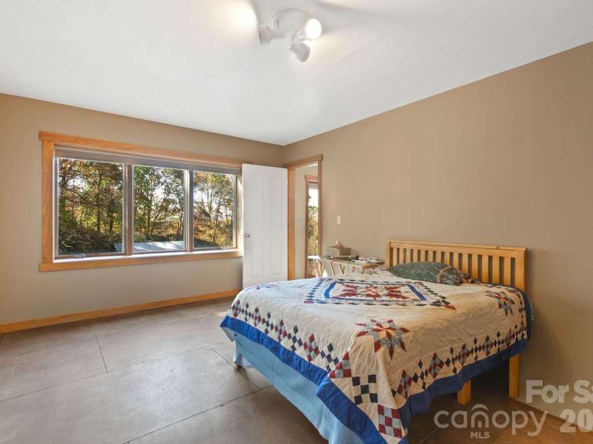 97 Old Cove Road, Black Mountain, NC 28711.  MLS# CAR4359155, YatesRealty ID 20366. Basement bedroom