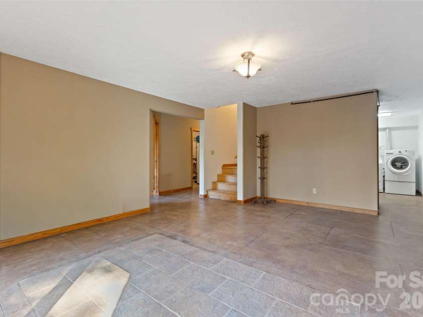 97 Old Cove Road, Black Mountain, NC 28711.  MLS# CAR4359155, YatesRealty ID 20366. Large den space in basement
