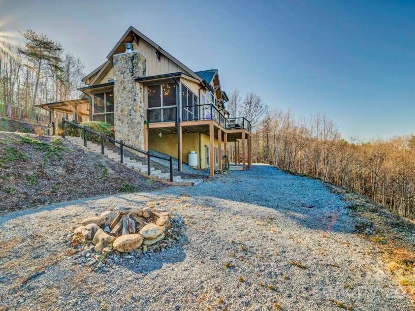 146 Sarinac Drive, Bostic, NC 28018.  MLS# CAR4327091, YatesRealty ID 2037. A large side yard offers a firepit 