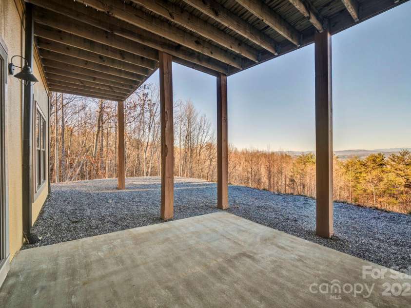 146 Sarinac Drive, Bostic, NC 28018.  MLS# CAR4327091, YatesRealty ID 2037. Lower patio area