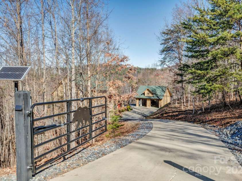 146 Sarinac Drive, Bostic, NC 28018.  MLS# CAR4327091, YatesRealty ID 2037. Solar powered gated entance to the home