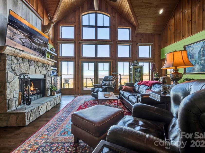 146 Sarinac Drive, Bostic, NC 28018.  MLS# CAR4327091, YatesRealty ID 2037. The gas burning rock fireplace is both functional in the winter and centerpiece year round