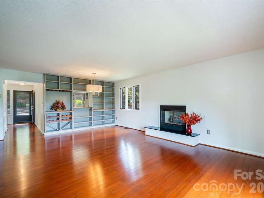 305 Piney Mountain Drive, Asheville, NC 28805.  MLS# CAR4351892, YatesRealty ID 20378. Open concept - dining/living room with gas fireplace