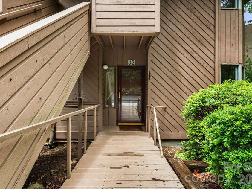 305 Piney Mountain Drive, Asheville, NC 28805.  MLS# CAR4380545, YatesRealty ID 20378. Unit front door