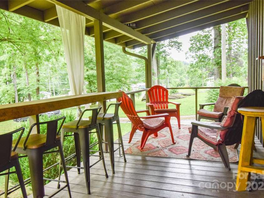 3435 Conleys Creek Road, Whittier, NC 28789.  MLS# CAR4272646, YatesRealty ID 20379. Listen to the creek from the deck