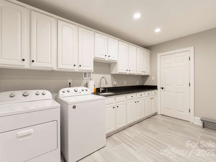 239 Kimberly Road, Davidson, NC 28036.  MLS# CAR4288776, YatesRealty ID 2038. Large laundry room