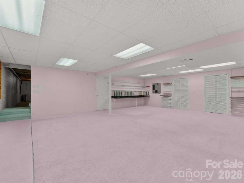 476 Jackson Loop Road, Flat Rock, NC 28731.  MLS# CAR4363362, YatesRealty ID 20386. Basement / Craft Room