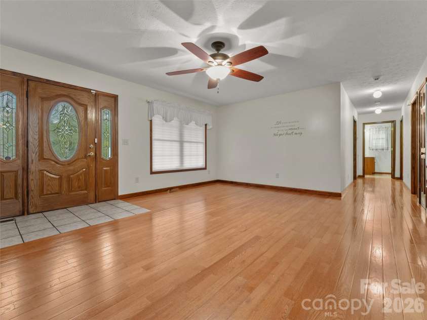 476 Jackson Loop Road, Flat Rock, NC 28731.  MLS# CAR4363362, YatesRealty ID 20386. Front Door/ Living Room