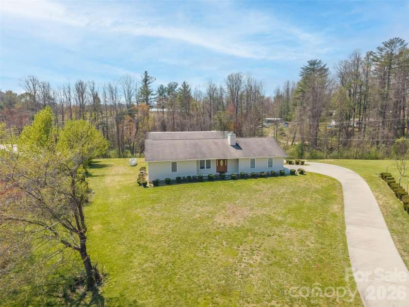 476 Jackson Loop Road, Flat Rock, NC 28731.  MLS# CAR4363362, YatesRealty ID 20386. Front yard