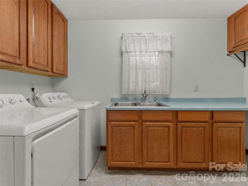 476 Jackson Loop Road, Flat Rock, NC 28731.  MLS# CAR4363362, YatesRealty ID 20386. Laundry on Main