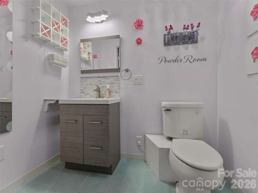 476 Jackson Loop Road, Flat Rock, NC 28731.  MLS# CAR4363362, YatesRealty ID 20386. Powder room in basement