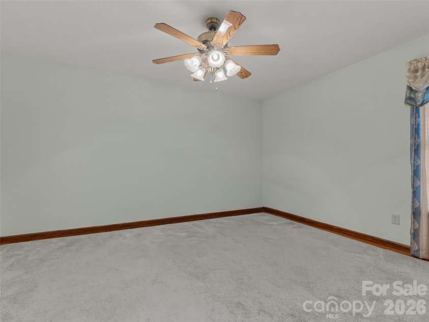 476 Jackson Loop Road, Flat Rock, NC 28731.  MLS# CAR4363362, YatesRealty ID 20386. Primary Bedroom w/ ensuite