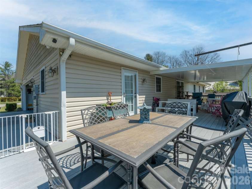 476 Jackson Loop Road, Flat Rock, NC 28731.  MLS# CAR4363362, YatesRealty ID 20386. Uncovered Deck