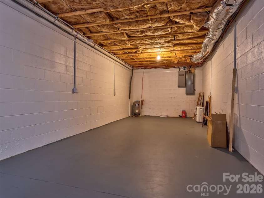 476 Jackson Loop Road, Flat Rock, NC 28731.  MLS# CAR4363362, YatesRealty ID 20386. Unfinished storage in basement