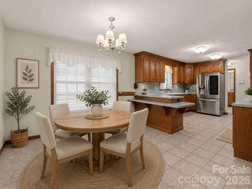 476 Jackson Loop Road, Flat Rock, NC 28731.  MLS# CAR4363362, YatesRealty ID 20386. Virtually Staged Dining Area