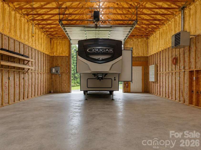 476 Jackson Loop Road, Flat Rock, NC 28731.  MLS# CAR4363362, YatesRealty ID 20386. Virtually Staged RV Garage/ workshop
