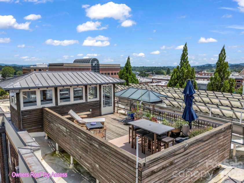 203 6th Avenue, Hendersonville, NC 28739.  MLS# CAR4288242, YatesRealty ID 2039. Exclusive Rooftop escape for condo owners to enjoy