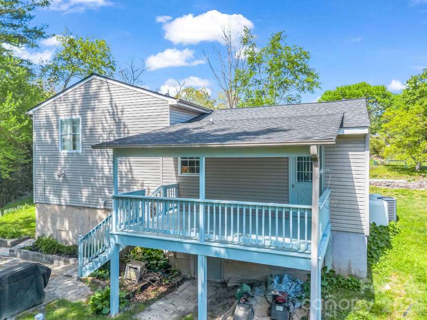 227 Bradshaw Avenue, Hendersonville, NC 28792.  MLS# CAR4370884, YatesRealty ID 20390. Covered back deck with access to the backyard and firepit area