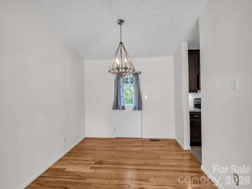 227 Bradshaw Avenue, Hendersonville, NC 28792.  MLS# CAR4370884, YatesRealty ID 20390. Dining room that leads to back deck