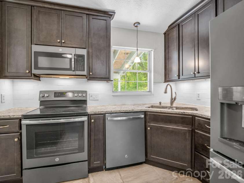 227 Bradshaw Avenue, Hendersonville, NC 28792.  MLS# CAR4370884, YatesRealty ID 20390. Kitchen full of function and style!