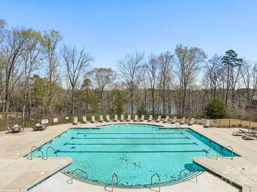 1034 Currituck Way, York, SC 29745.  MLS# CAR4239993, YatesRealty ID 20391. Community pool with view of Lake