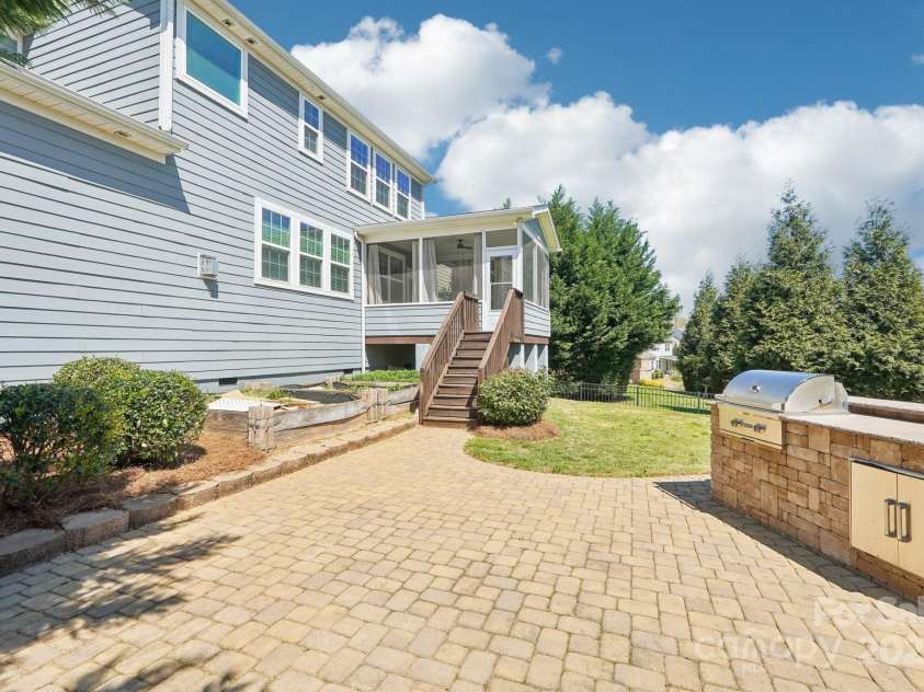 1034 Currituck Way, York, SC 29745.  MLS# CAR4239993, YatesRealty ID 20391. Outdoor Grill, paver patio and garden area