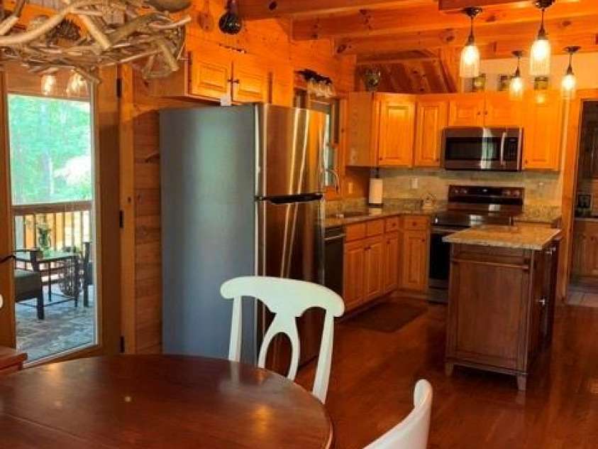 106 Lake Terrace Drive, Nebo, NC 28761.  MLS# CAR4302571, YatesRealty ID 2040. Kitchen, Dining and Screened In Porch
