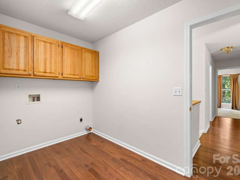 701 Salisbury Road, Hendersonville, NC 28792.  MLS# CAR4279569, YatesRealty ID 2040. Large Laundry Room on the main floor -