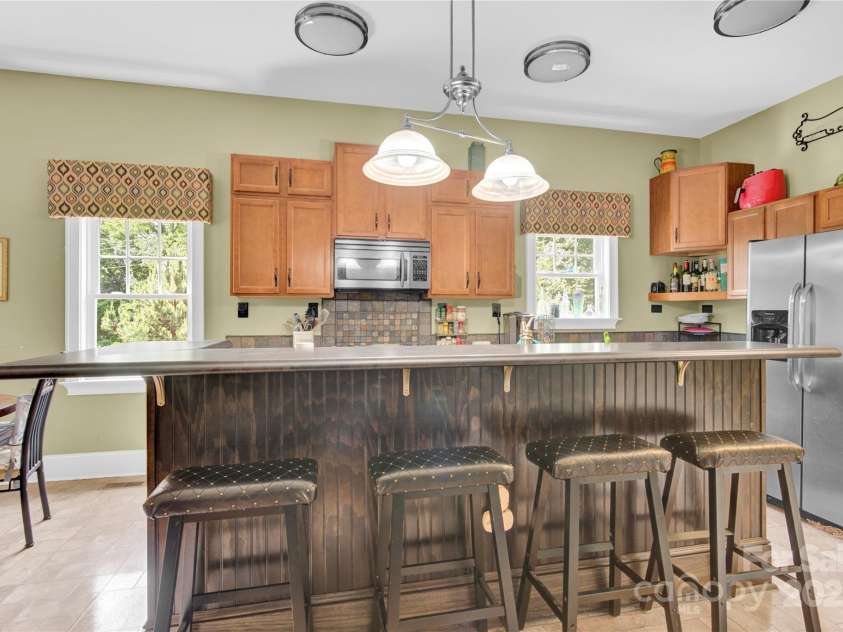 267 Ikerd Drive, Concord, NC 28025.  MLS# CAR4264417, YatesRealty ID 20402. Kitchen counter eating:)