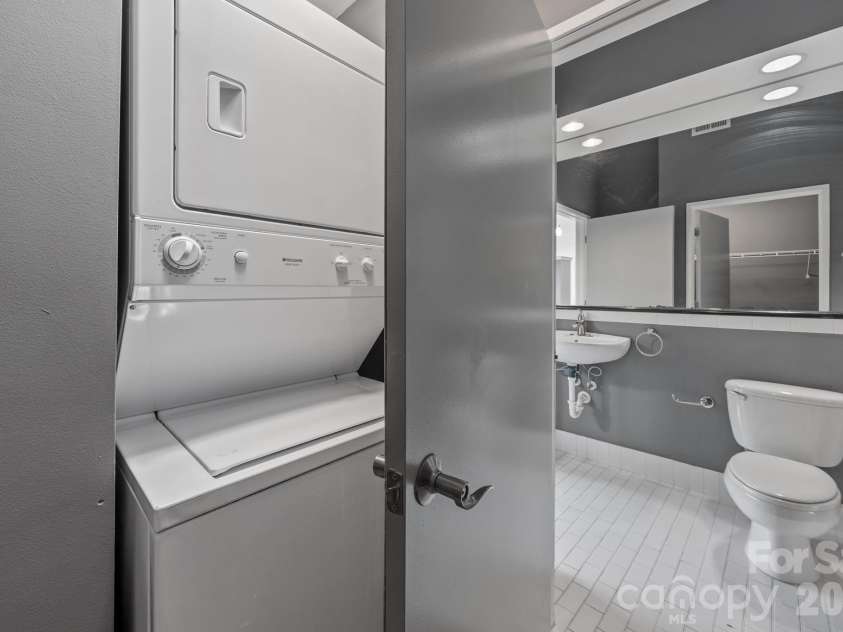 514 10th Street, Charlotte, NC 28202.  MLS# CAR4366152, YatesRealty ID 20407. In-unit laundry closet featuring a stacked washer and dryer.