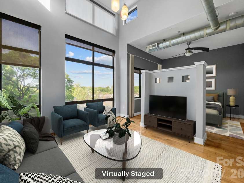 514 10th Street, Charlotte, NC 28202.  MLS# CAR4366152, YatesRealty ID 20407. Open living and dining area featuring industrial-style exposed ductwork (virtually staged).