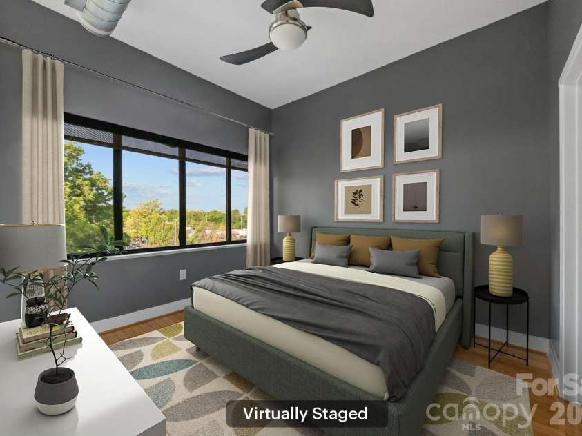 514 10th Street, Charlotte, NC 28202.  MLS# CAR4366152, YatesRealty ID 20407. Spacious main bedroom featuring an accent wall and large window (virtually staged).