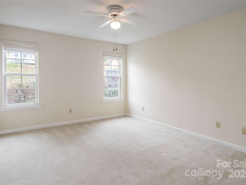 4805 Breakers Lane, Asheville, NC 28806.  MLS# CAR4307390, YatesRealty ID 2041. Guest / 2nd bedroom or office area with two closets. Private entry to main bathroom.