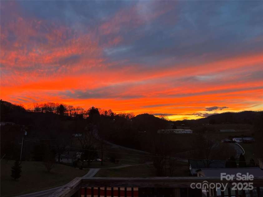 49 Perseverance Drive, Canton, NC 28716.  MLS# CAR4259278, YatesRealty ID 20414. Porch sunset view!