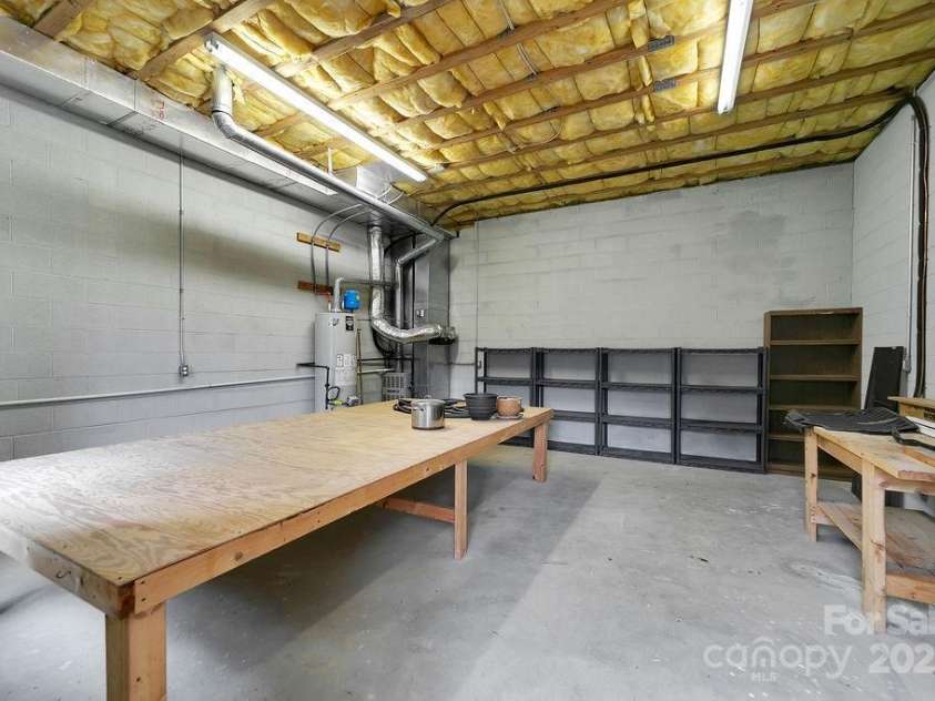 54 Wintergreen Drive, Brevard, NC 28712.  MLS# CAR4306705, YatesRealty ID 20417. Basement storage