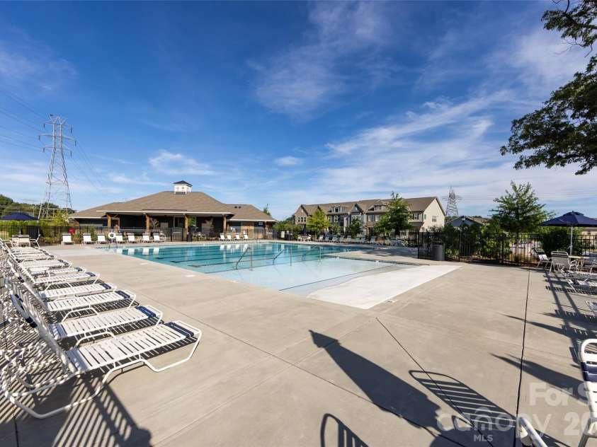 11440 Westbranch Parkway, Davidson, NC 28036.  MLS# CAR4366825, YatesRealty ID 20419. Resort-style community pool with spacious sun deck, lounge seating, and a clubhouse—perfect for relaxing or entertaining.