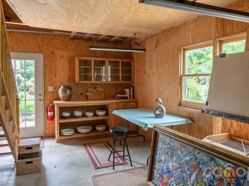 140 Elijah Hall Road, Black Mountain, NC 28711.  MLS# CAR4376953, YatesRealty ID 20420. Downstairs garage workshop