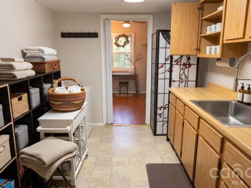 140 Elijah Hall Road, Black Mountain, NC 28711.  MLS# CAR4376953, YatesRealty ID 20420. Gally/utility room