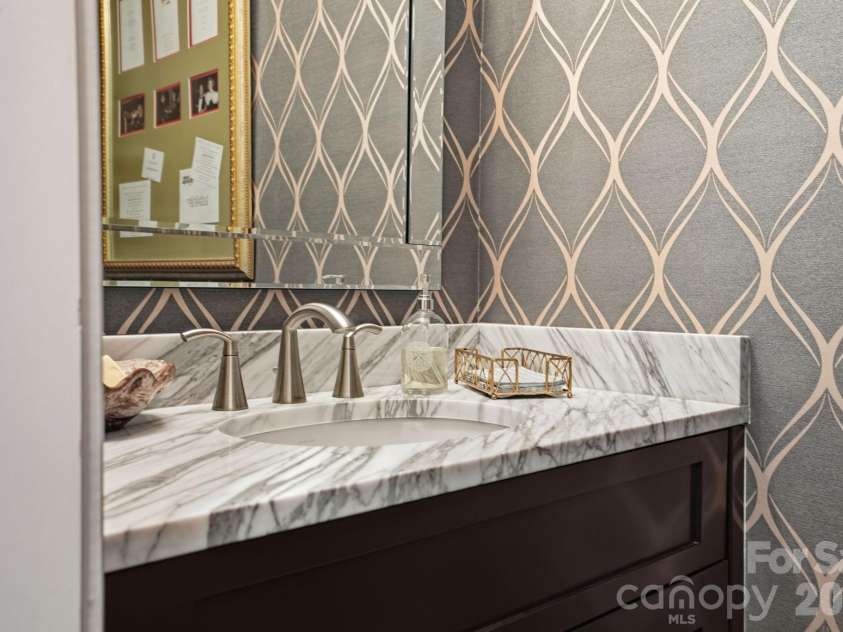 147 Torrence Chapel Road, Mooresville, NC 28117.  MLS# CAR4376776, YatesRealty ID 20424. Main floor half bath with striking wall paper. 