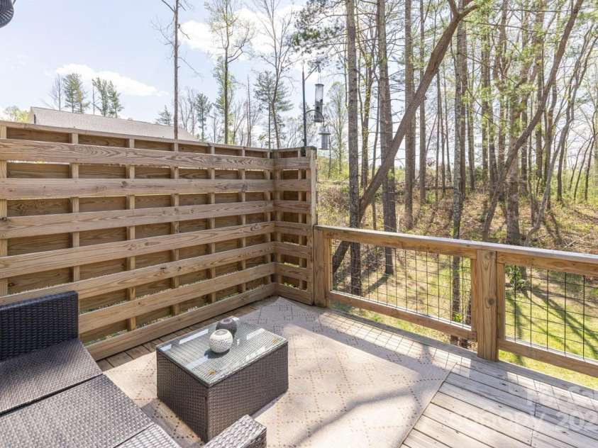 209 Fall Leaves Drive, Fairview, NC 28730.  MLS# CAR4312679, YatesRealty ID 20427. Back deck off dining.