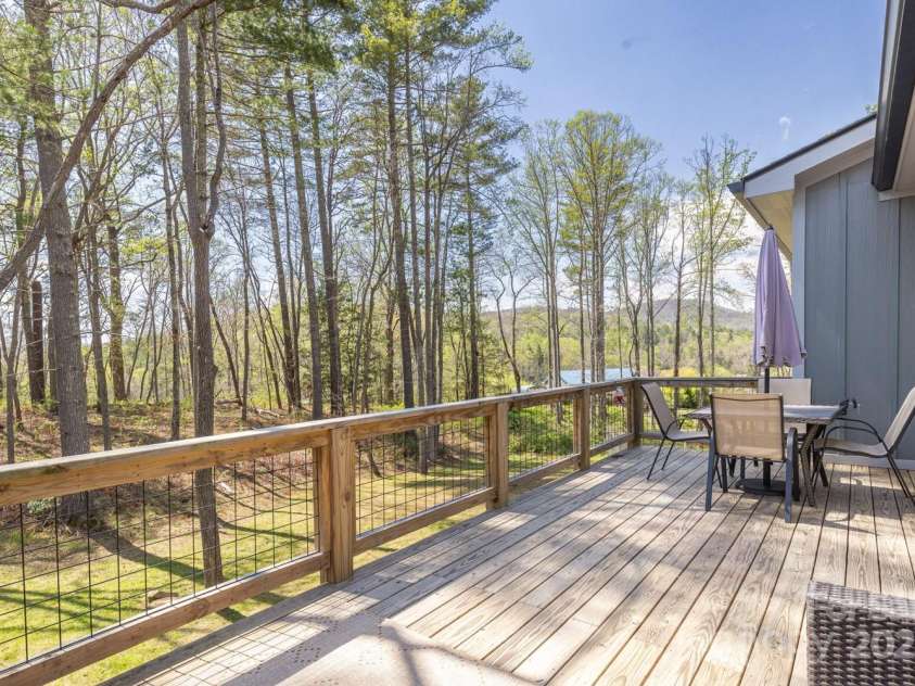 209 Fall Leaves Drive, Fairview, NC 28730.  MLS# CAR4312679, YatesRealty ID 20427. Back deck off dining.
