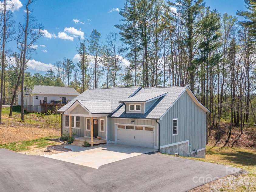 209 Fall Leaves Drive, Fairview, NC 28730.  MLS# CAR4312679, YatesRealty ID 20427. Beautiful home with main level 2 car garage Plenty of room to set up pickleball and play. The current owners do.
